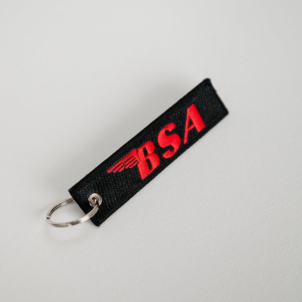 Dreamcycle Motorcycle Museum | BSA Black Keychain on white background. 