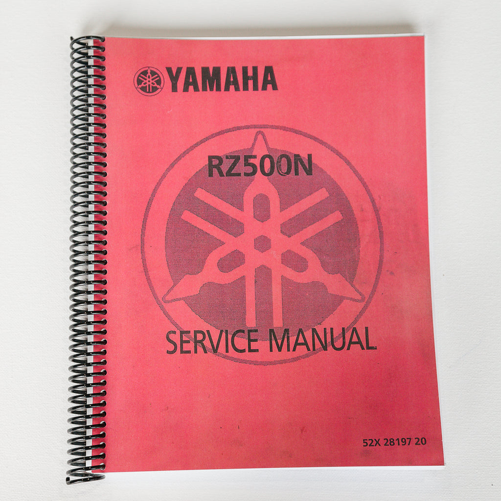 Dreamcycle Motorcycle Museum |  Yamaha RZ500N Service manual on white background.