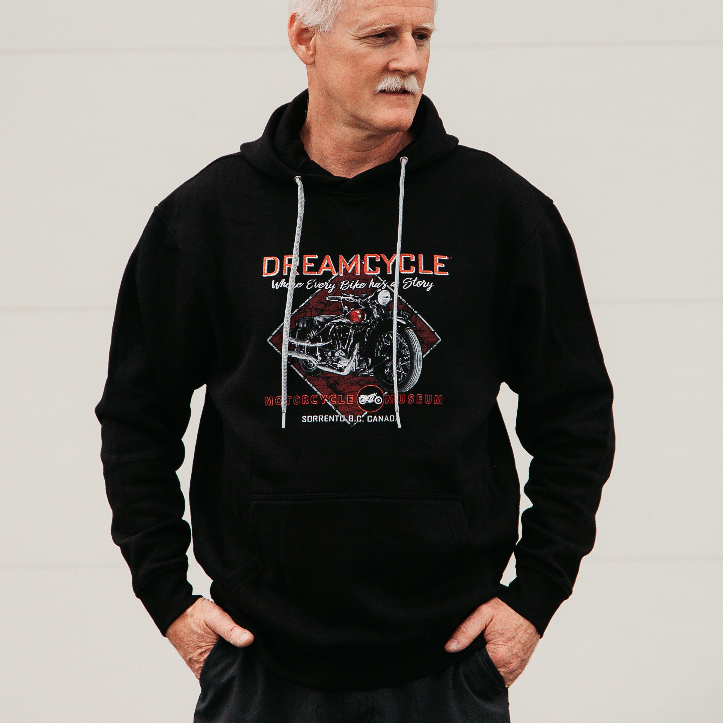 Dreamcycle Motorcycle Museum |  Male modelling dreamcycle hoodie in lifestyle environment.