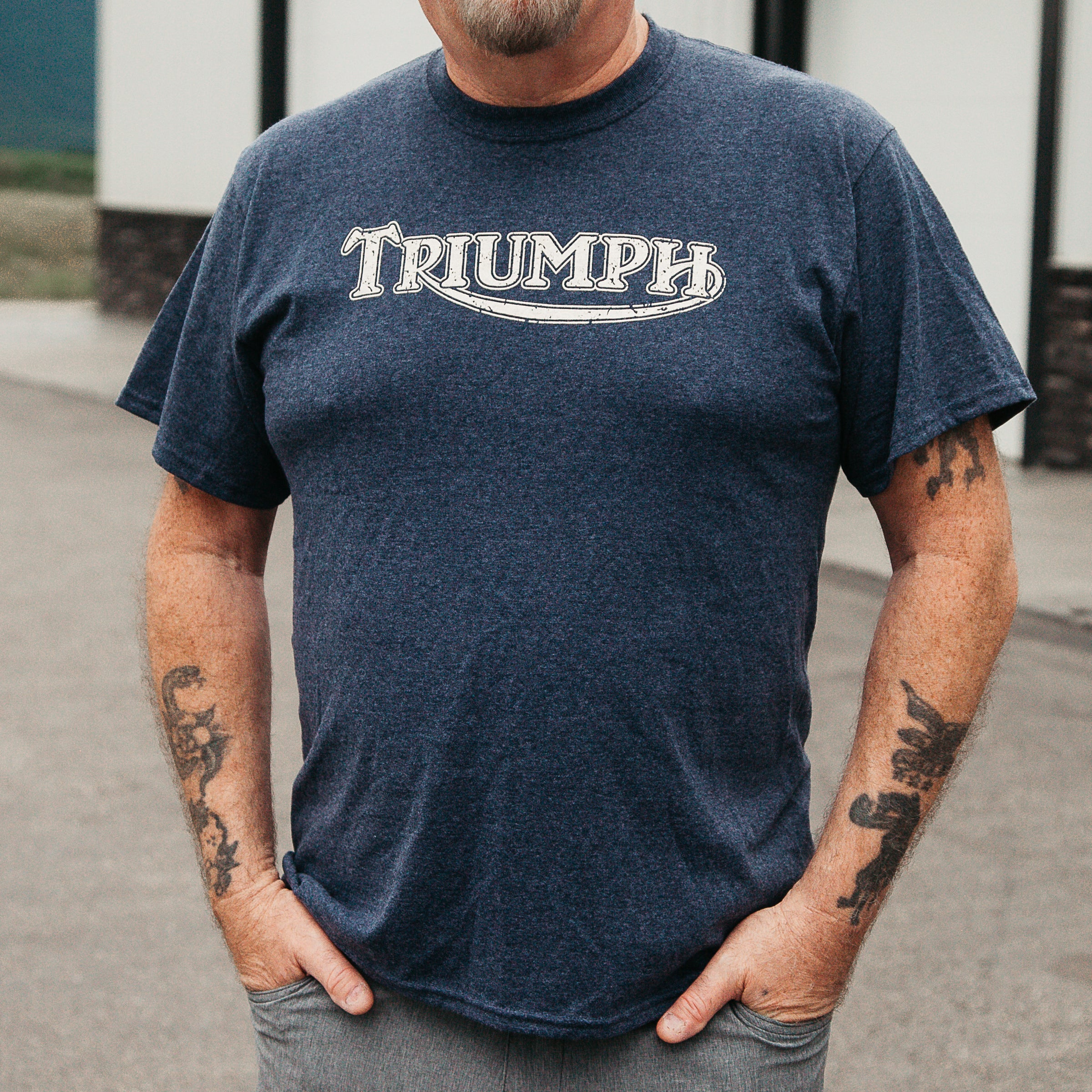 Dreamcycle Motorcycle Museum |  Man modeling Triumph tshirt in lifestyle environment. 