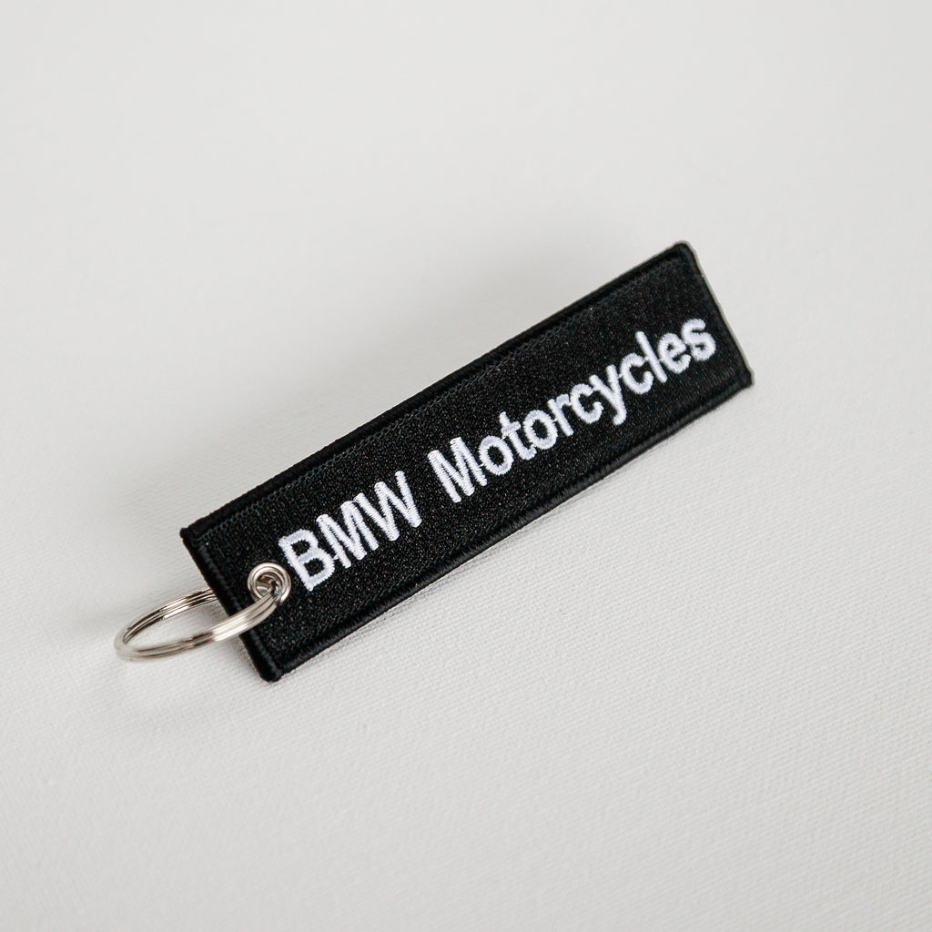 Dreamcycle Motorcycle Museum |  Black Keychain with text "BMW Motorcycles" on White Background. 