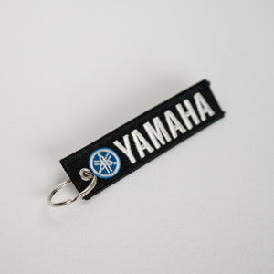 Open image in slideshow, Dreamcycle Motorcycle Museum |  Yamaha keychain on white background.\
